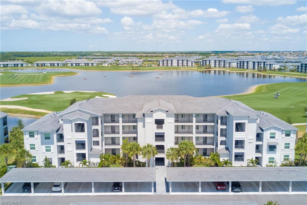 5807 Double Eagle Cir Avenue, Unit 4635 Immokalee, FL 34142 - Photo 3 of 43 a view of a large building with a city view