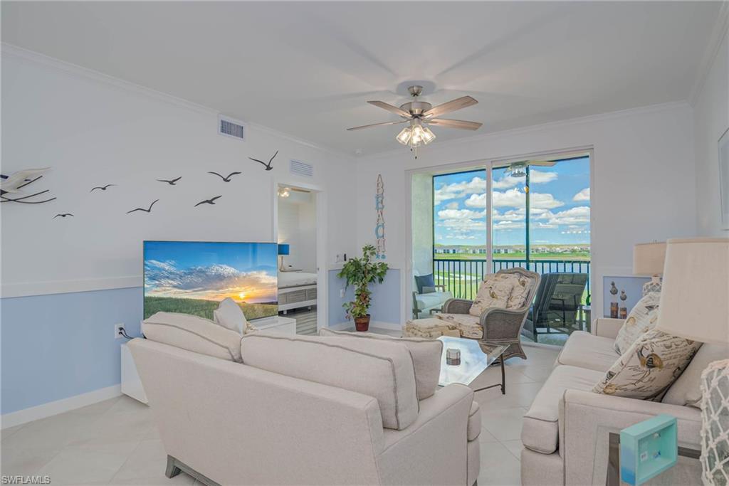 5807 Double Eagle Cir Avenue, Unit 4635 Immokalee, FL 34142 - Photo 6 of 43 a living room with furniture and a large window