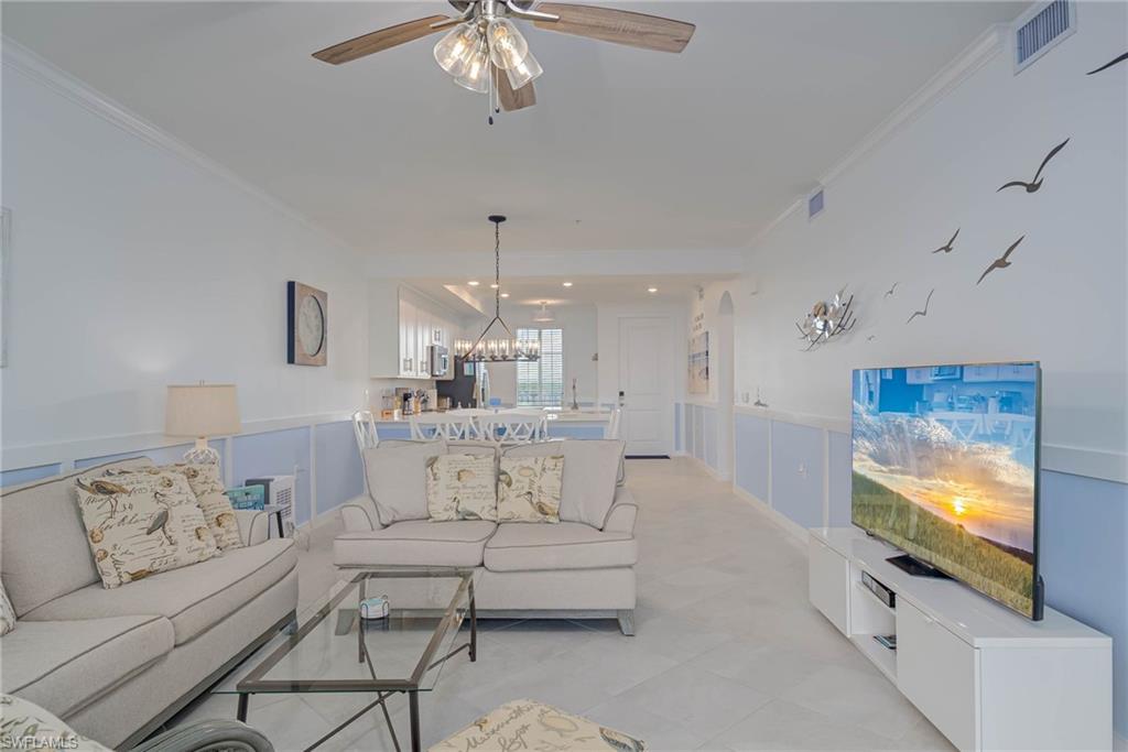 5807 Double Eagle Cir Avenue, Unit 4635 Immokalee, FL 34142 - Photo 8 of 43 a living room with furniture and a flat screen tv