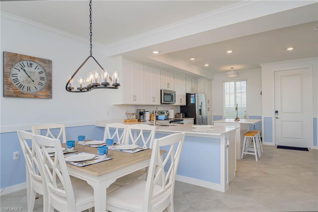 5807 Double Eagle Cir Avenue, Unit 4635 Immokalee, FL 34142 - Photo 9 of 43 a view of kitchen with cabinets table and chairs