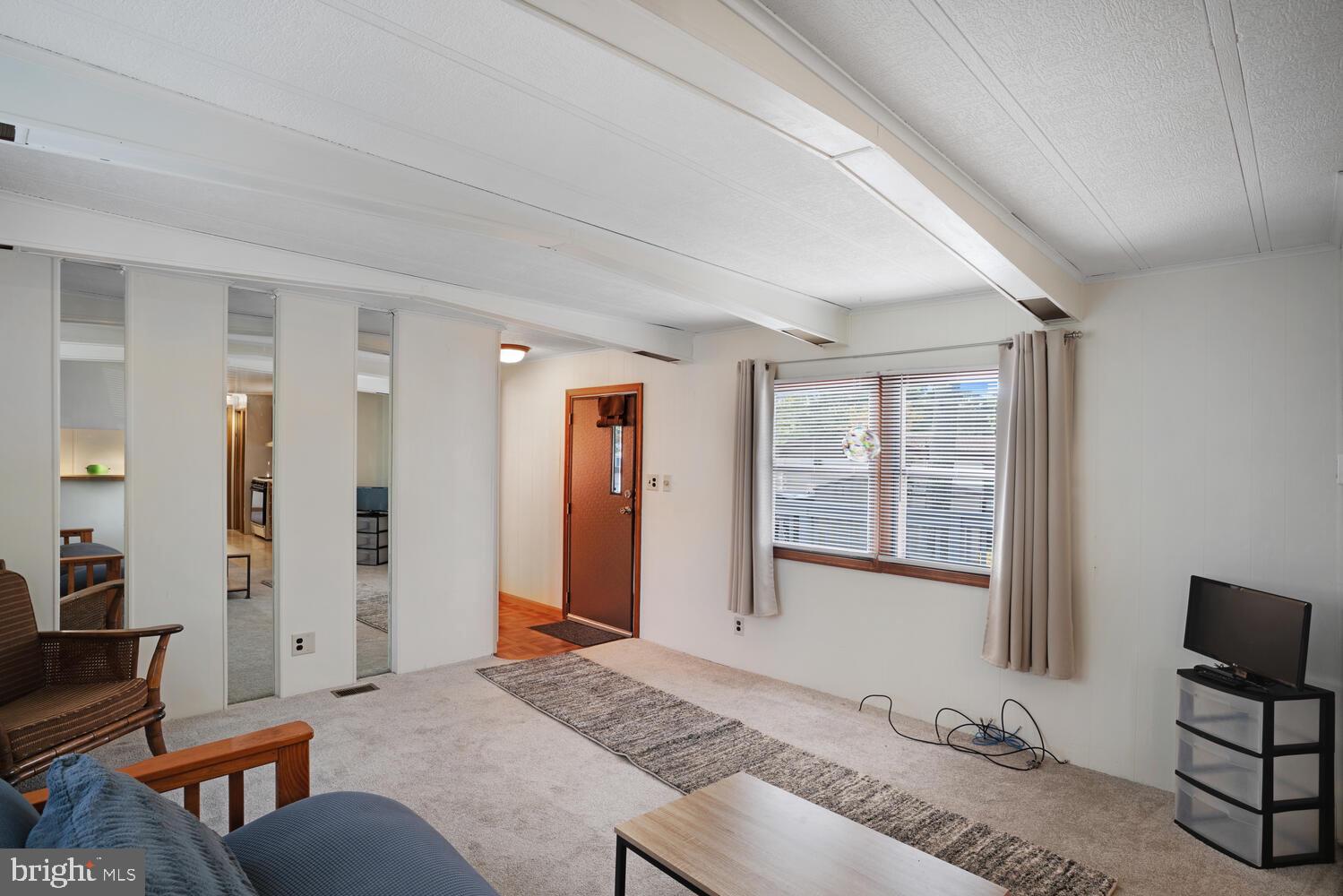 34 Holly Road West Creek, NJ 08092 - Photo 12 of 28 a spacious bedroom with a bed and wooden floor