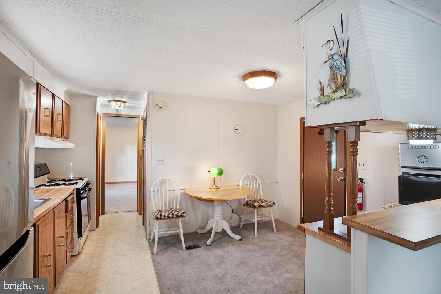 34 Holly Road West Creek, NJ 08092 - Photo 13 of 28 a dining room with furniture and window