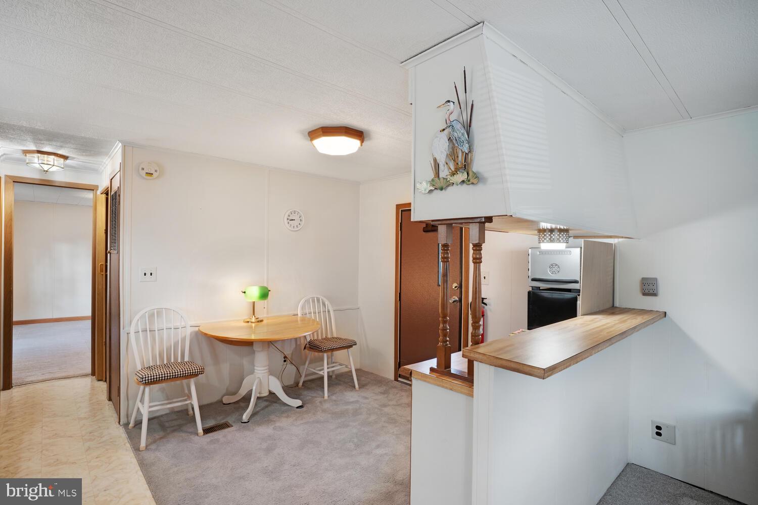 34 Holly Road West Creek, NJ 08092 - Photo 14 of 28 a kitchen with stainless steel appliances kitchen island granite countertop a refrigerator and a sink