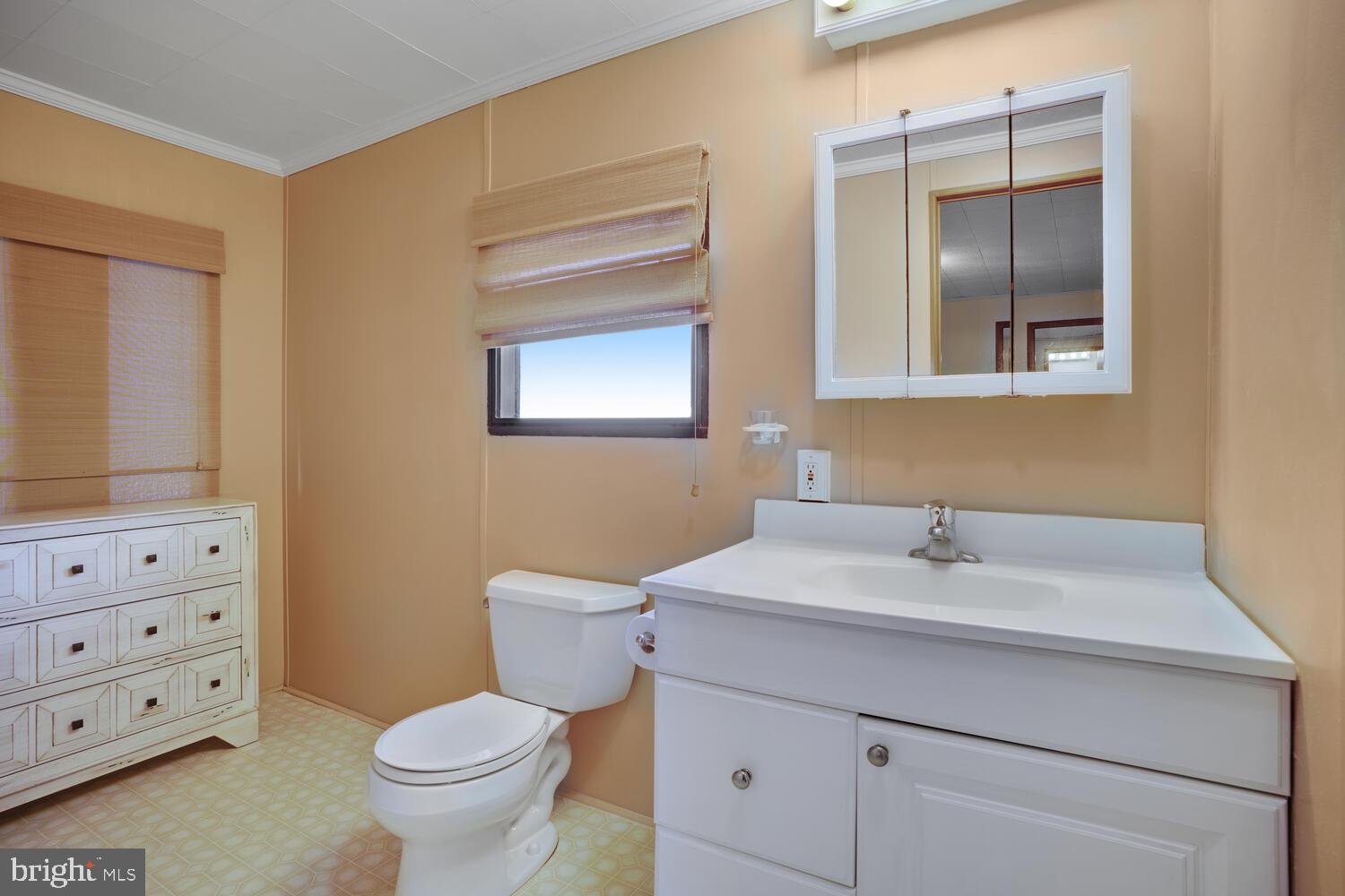 34 Holly Road West Creek, NJ 08092 - Photo 22 of 28 a bathroom with a sink toilet and mirror