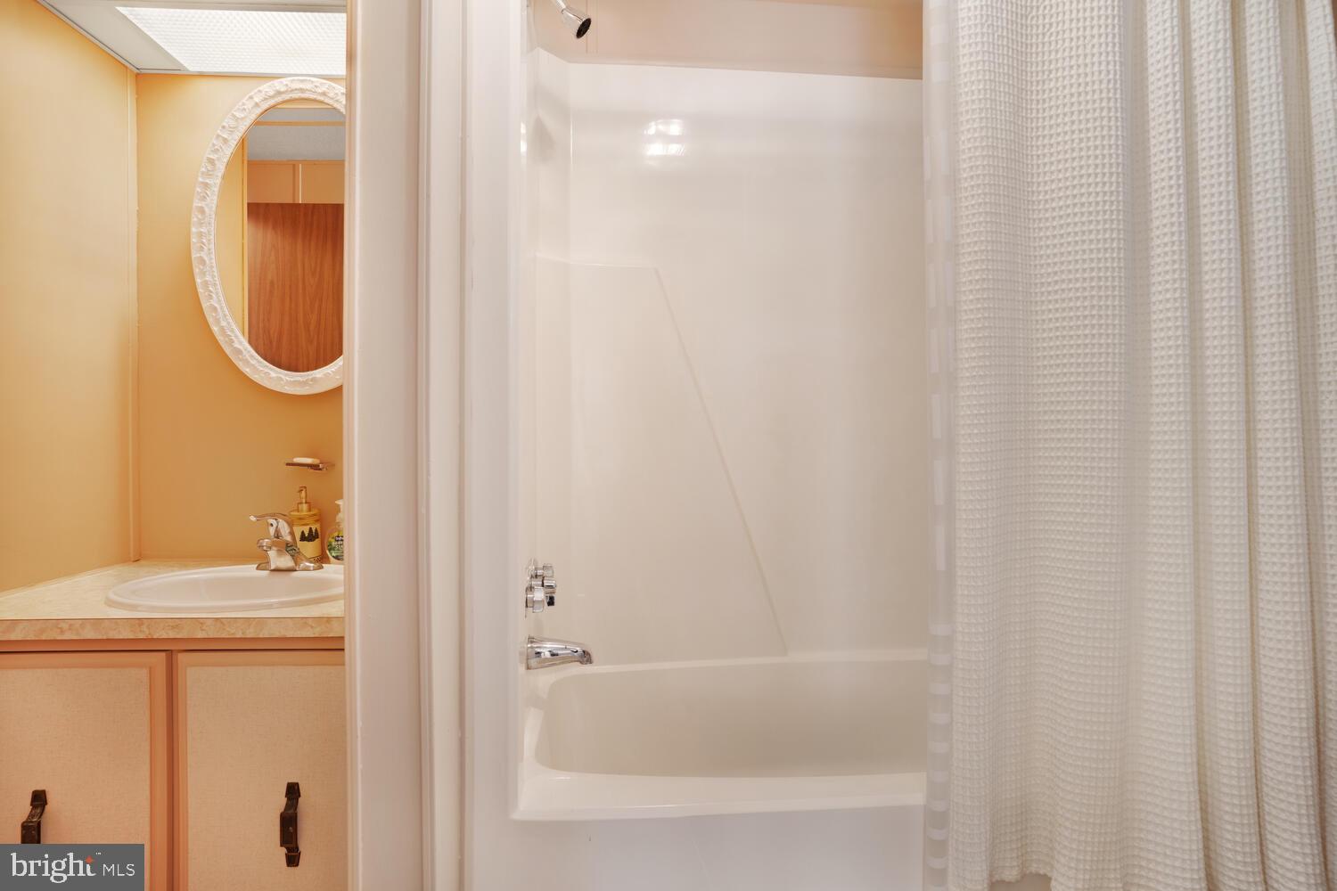 34 Holly Road West Creek, NJ 08092 - Photo 28 of 28 a bathroom with a bath tub and a sink