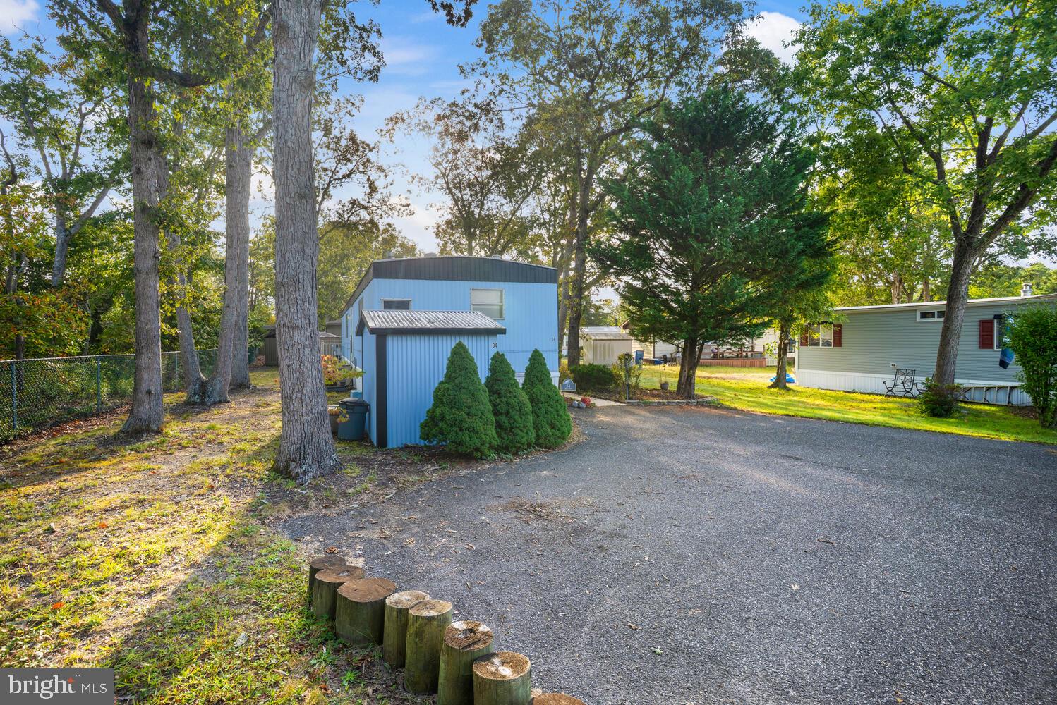 34 Holly Road West Creek, NJ 08092 - Photo 3 of 28 a view of a house with a yard and large tree