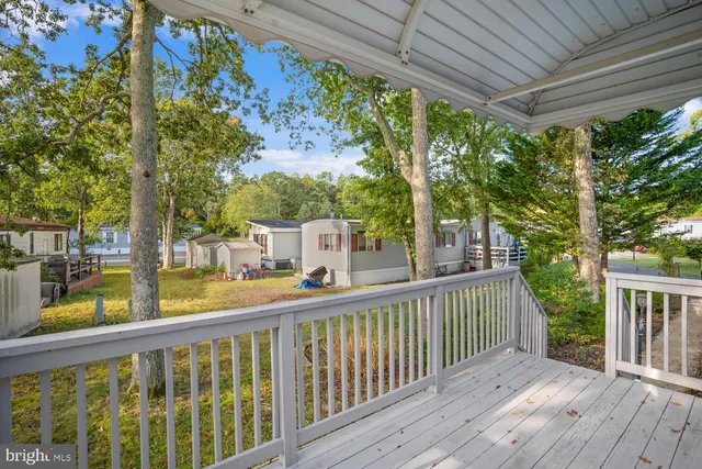 a view of a two chairs in the balcony