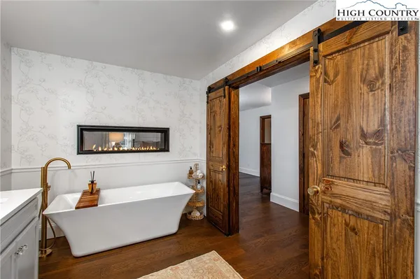 a bathroom with a sink vanity and a mirror