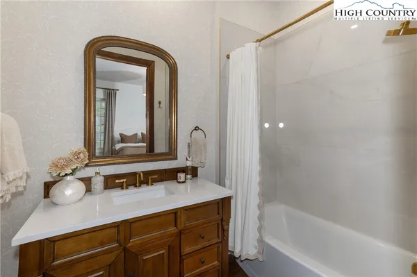 a kitchen with a table chairs and a refrigerator
