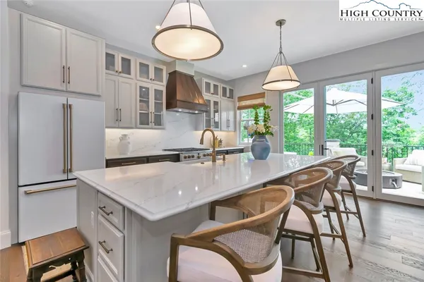 a stove top oven sitting inside of a kitchen