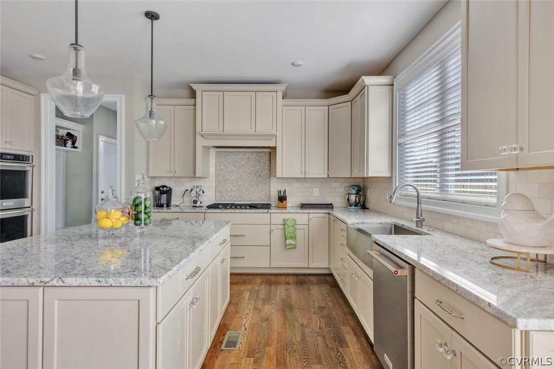 5154 Lake Summer Loop Moseley, VA 23120 - Photo 11 of 41 a kitchen with granite countertop a sink a counter space appliances and cabinets