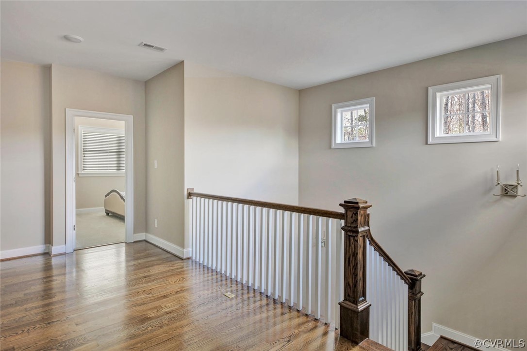 5154 Lake Summer Loop Moseley, VA 23120 - Photo 20 of 41 a view of a hallway with wooden floor and stairs