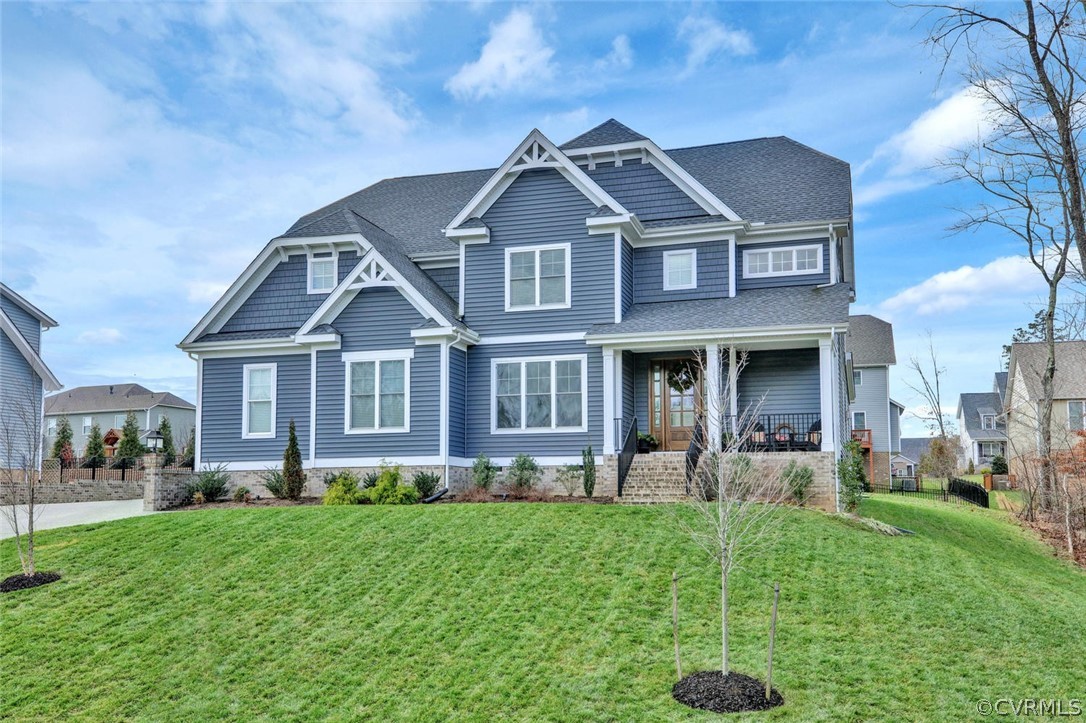 5154 Lake Summer Loop Moseley, VA 23120 - Photo 2 of 41 a front view of a house with a yard and trees