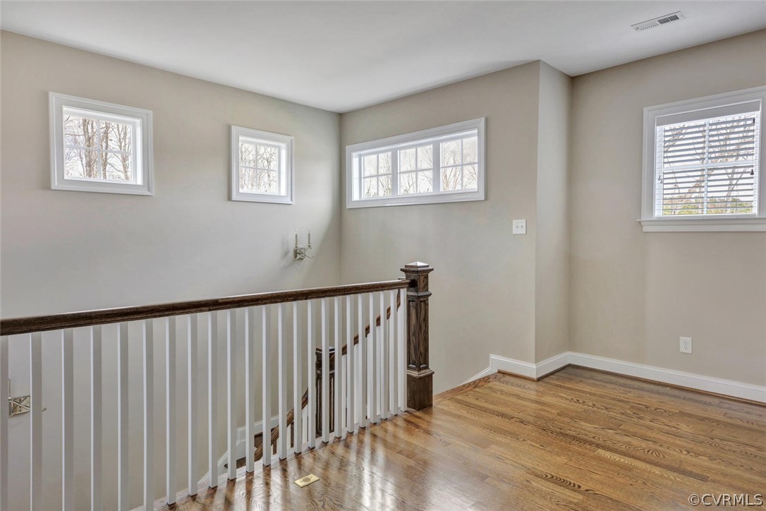 5154 Lake Summer Loop Moseley, VA 23120 - Photo 21 of 41 a view of empty room with wooden floor and fan