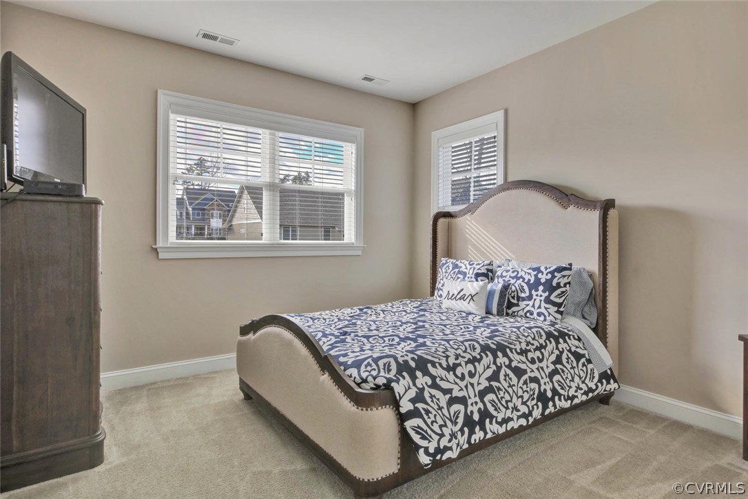 5154 Lake Summer Loop Moseley, VA 23120 - Photo 22 of 41 a bedroom with a bed wooden floor and window