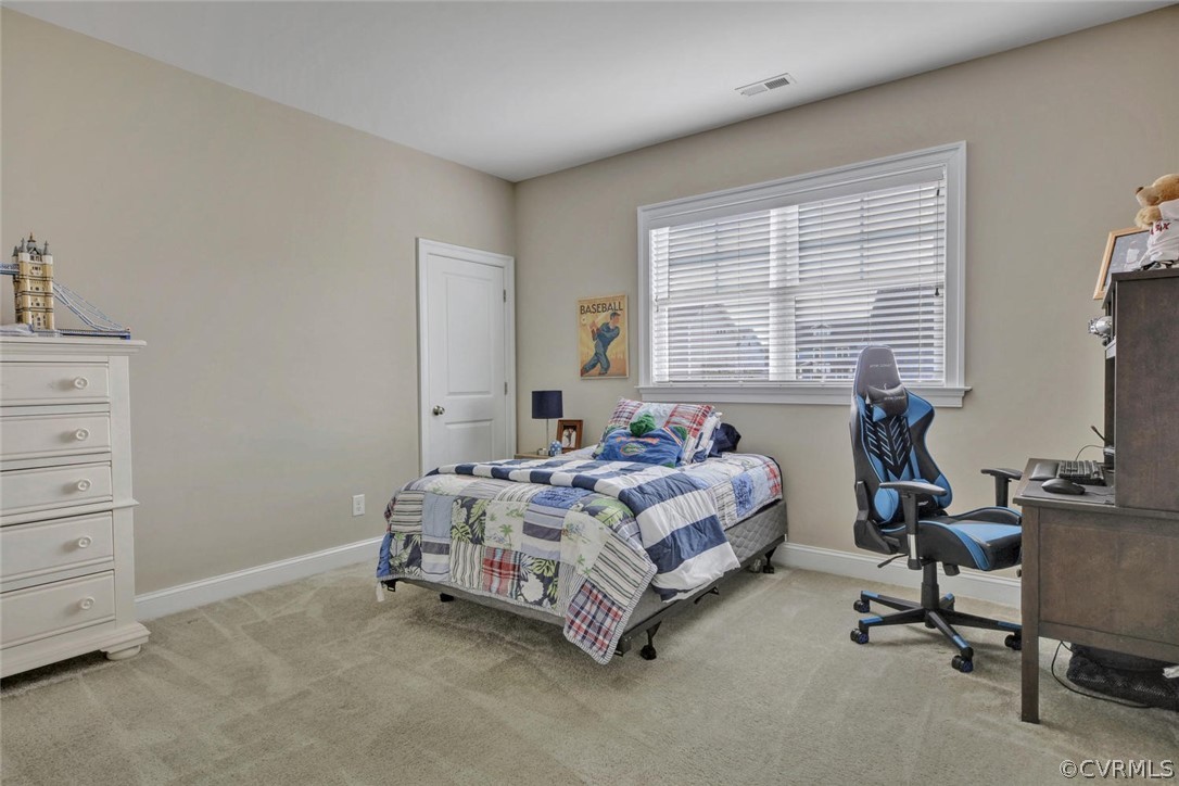 5154 Lake Summer Loop Moseley, VA 23120 - Photo 23 of 41 a bedroom with a bed and a window