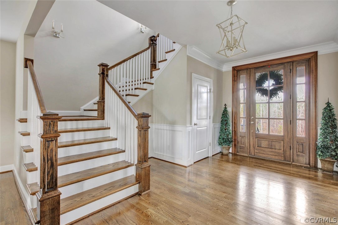 5154 Lake Summer Loop Moseley, VA 23120 - Photo 3 of 41 a view of a livingroom with wooden floor and stairs