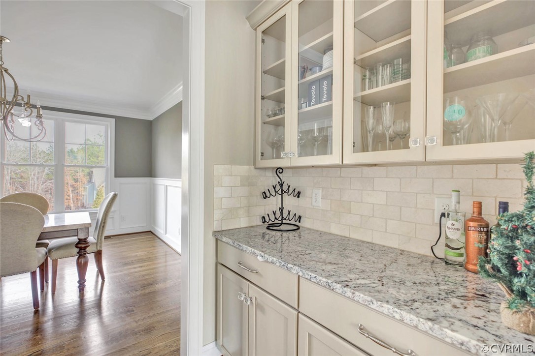 5154 Lake Summer Loop Moseley, VA 23120 - Photo 10 of 41 a view of a kitchen with granite countertop a dining table chairs in it and wooden floor