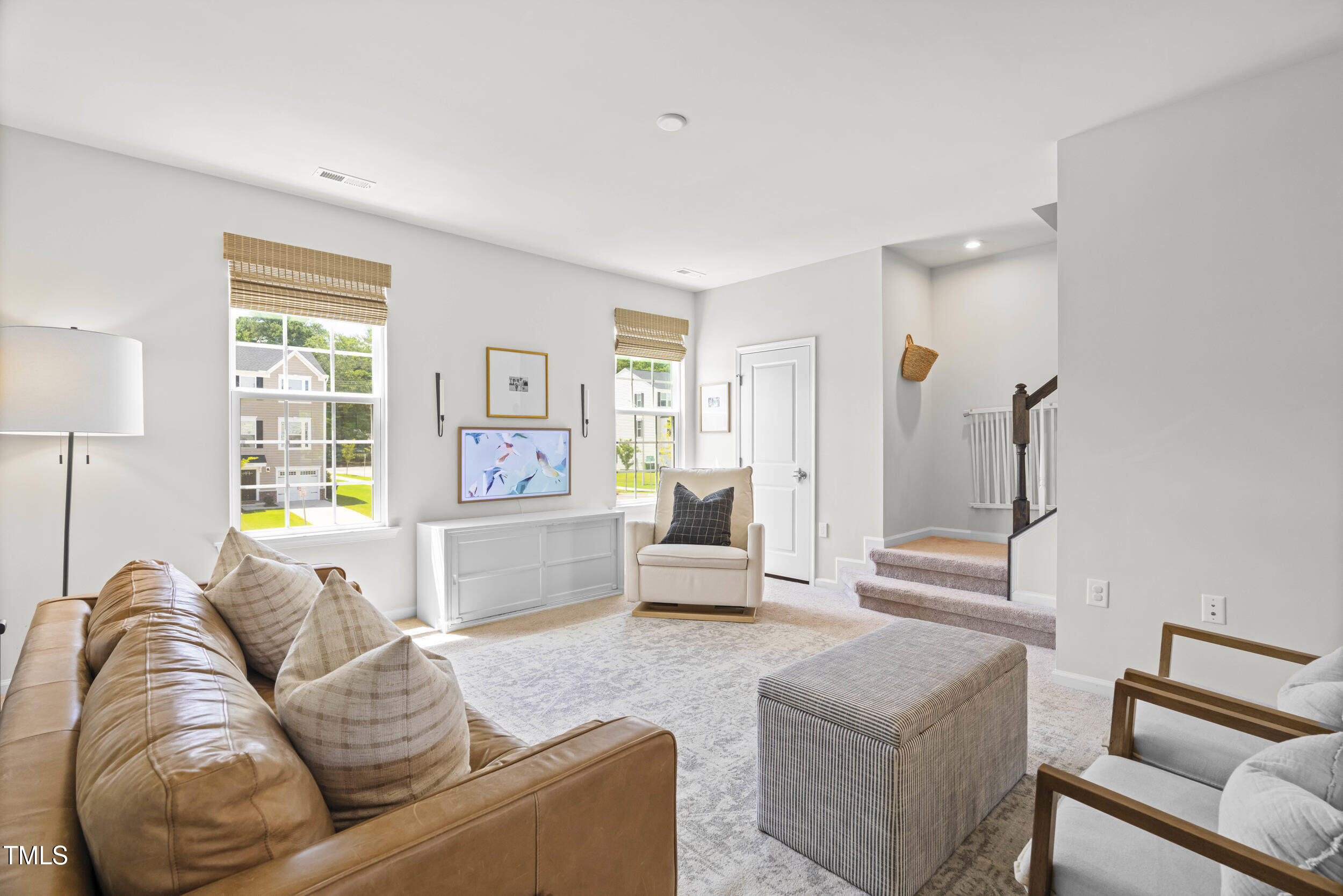 6607 Pathfinder Way Raleigh, NC 27616 - Photo 15 of 37 a living room with furniture and a large window