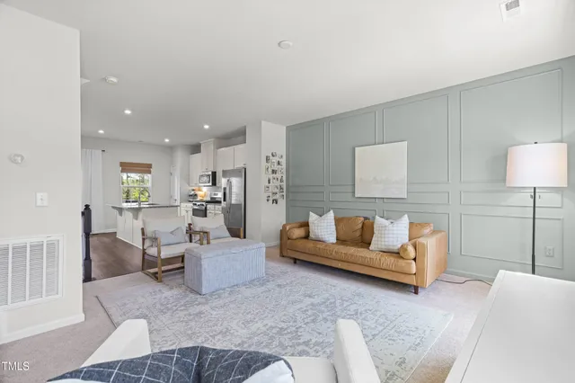 a living room with furniture and a table