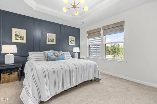 a spacious bedroom with a bed and a table