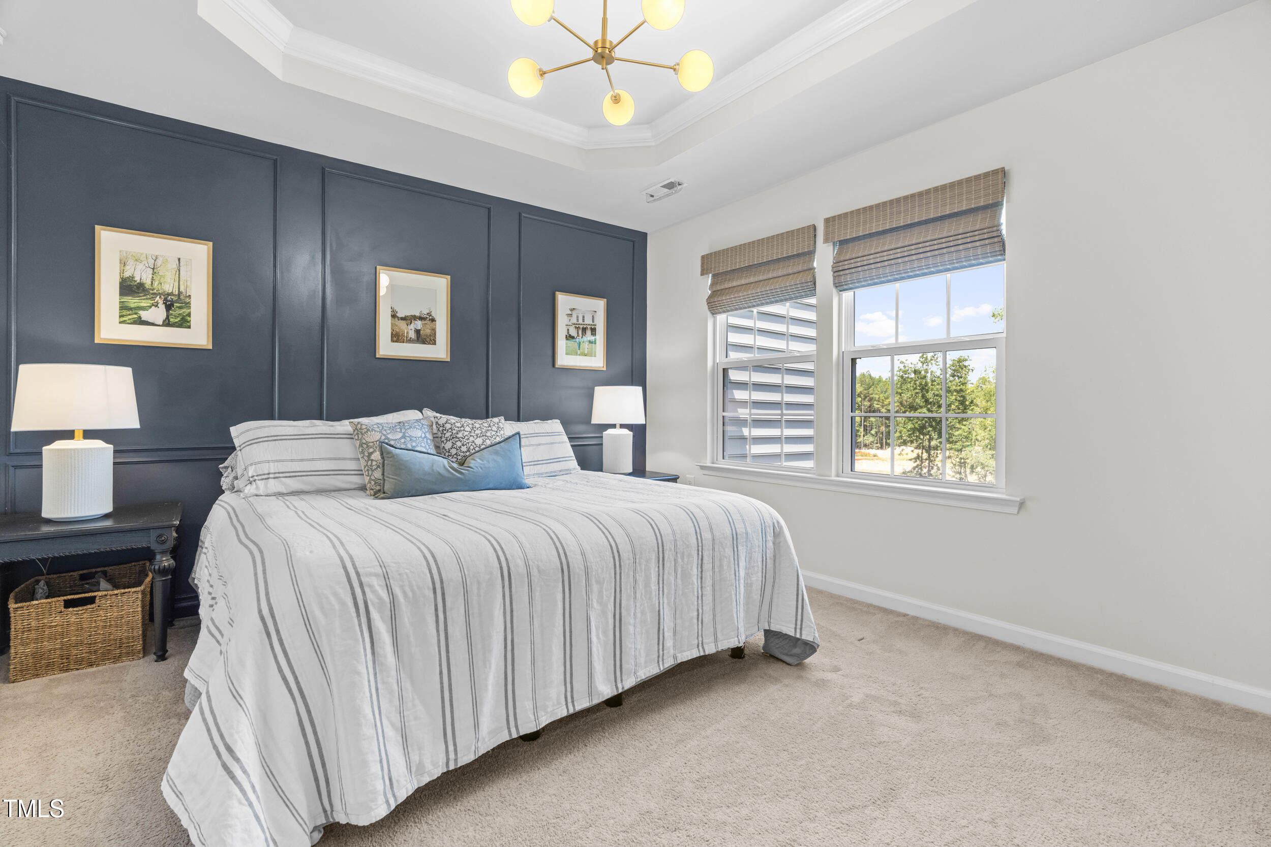6607 Pathfinder Way Raleigh, NC 27616 - Photo 22 of 37 a spacious bedroom with a bed and a table