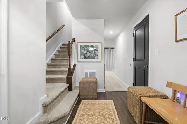 a living room with furniture and a rug