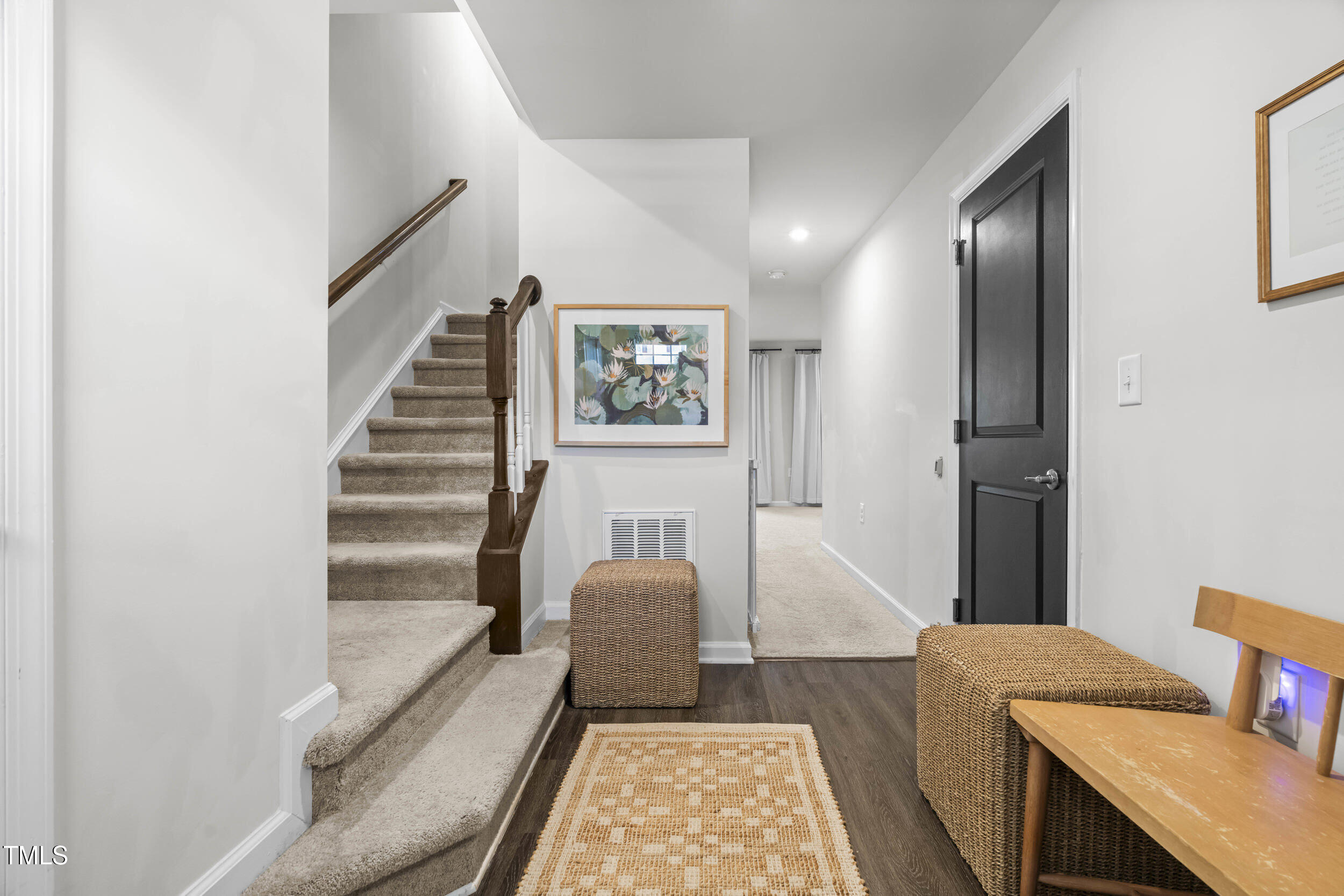 6607 Pathfinder Way Raleigh, NC 27616 - Photo 4 of 37 a living room with furniture and a rug