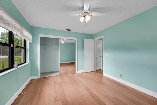 a bathroom with a sink toilet and mirror