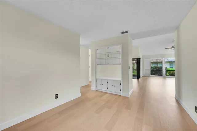 wooden floor with white walls