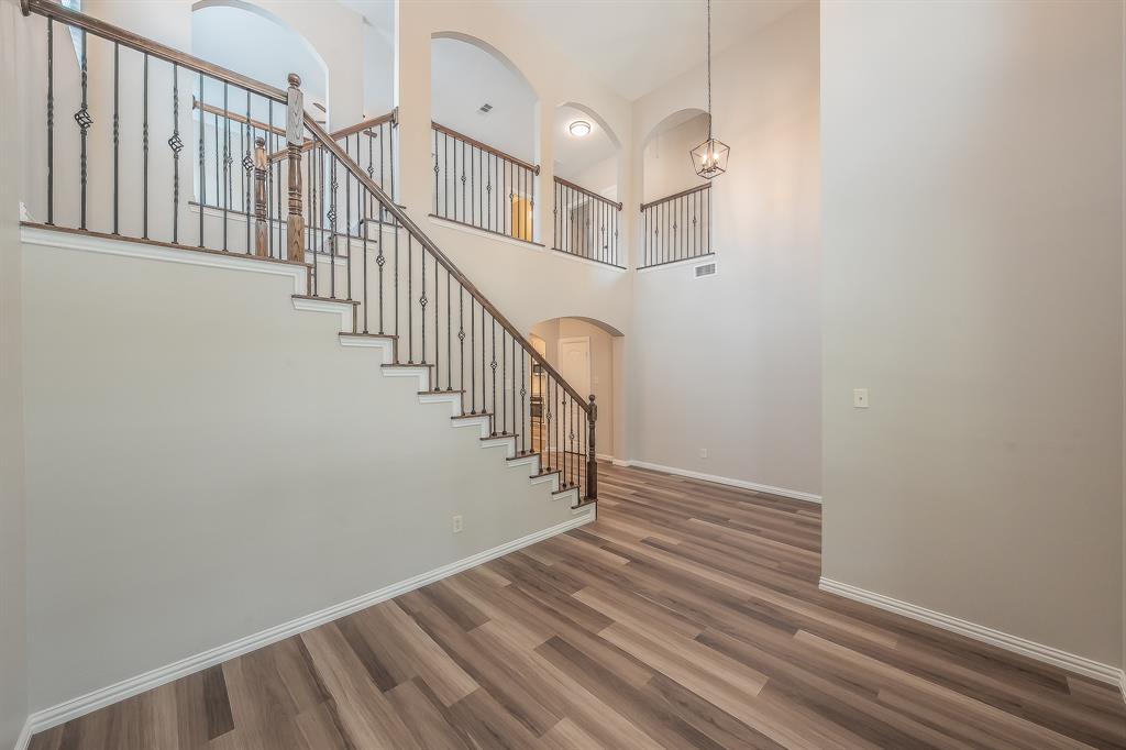 412 Hideaway Road McKinney, TX 75072 - Photo 5 of 40 a view of entryway and hall with wooden floor