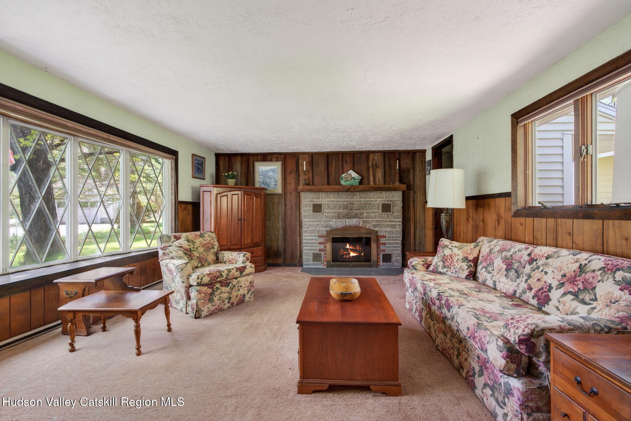 689 Old Road Windham, NY 12496 - Photo 11 of 42 a living room with furniture and a fireplace