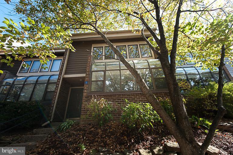 11011 Thrush Ridge Road Reston, VA 20191 - Photo 1 of 30 a front view of a house with garden