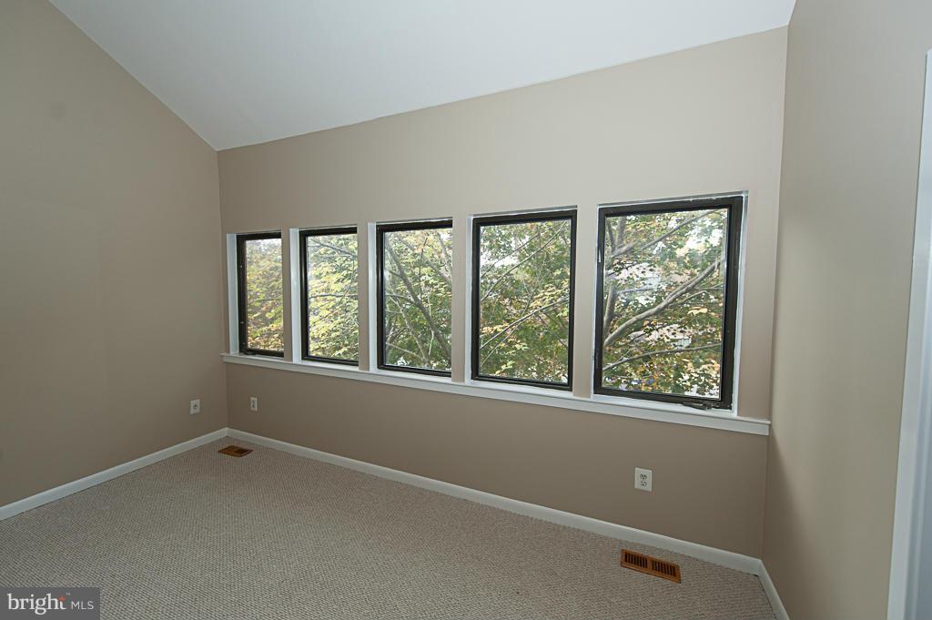 11011 Thrush Ridge Road Reston, VA 20191 - Photo 13 of 30 an empty room with a window