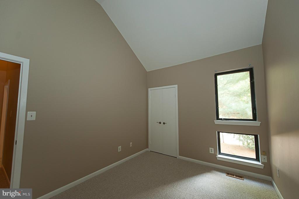 11011 Thrush Ridge Road Reston, VA 20191 - Photo 17 of 30 an empty room with windows