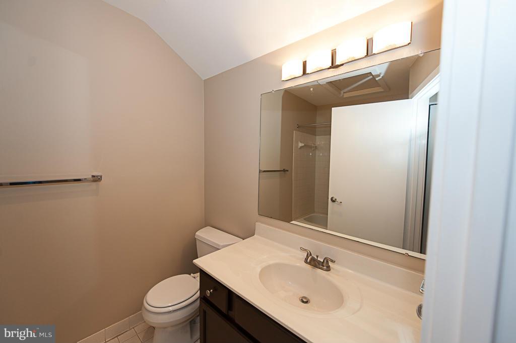 11011 Thrush Ridge Road Reston, VA 20191 - Photo 22 of 30 a bathroom with a sink toilet and vanity