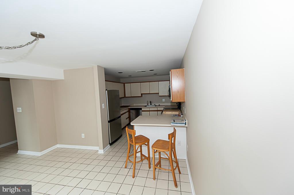 11011 Thrush Ridge Road Reston, VA 20191 - Photo 6 of 30 a kitchen with a stove and a refrigerator