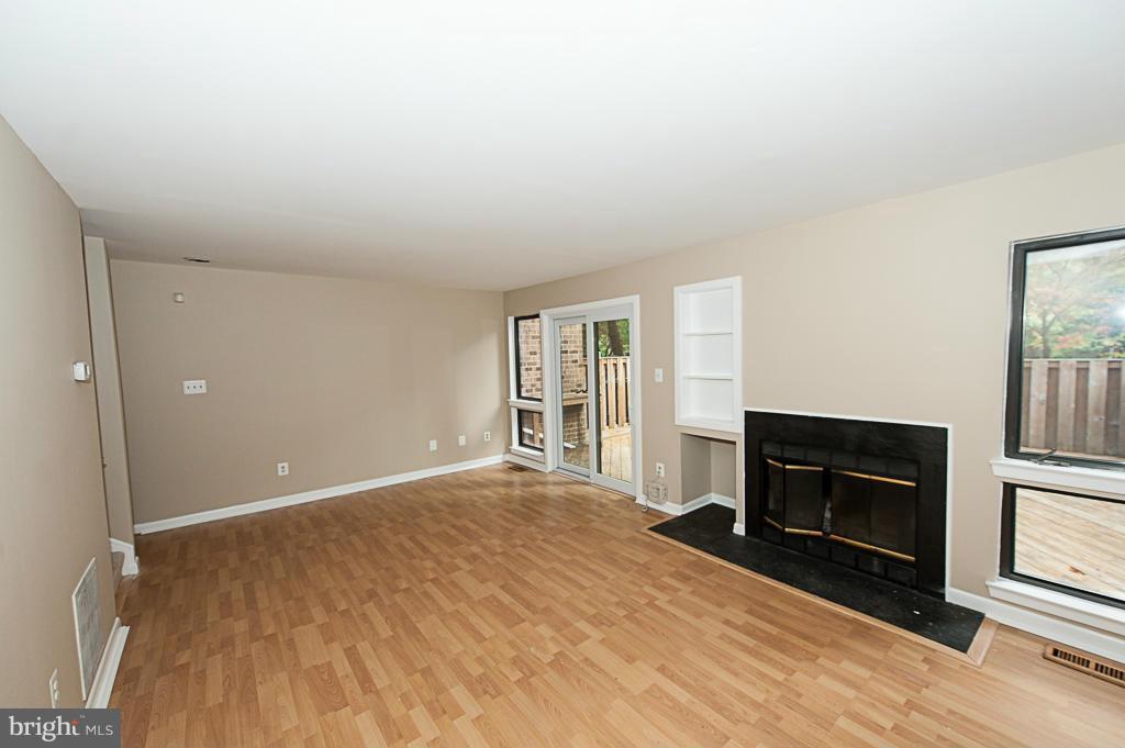 11011 Thrush Ridge Road Reston, VA 20191 - Photo 8 of 30 a view of empty room with fireplace and wooden floor