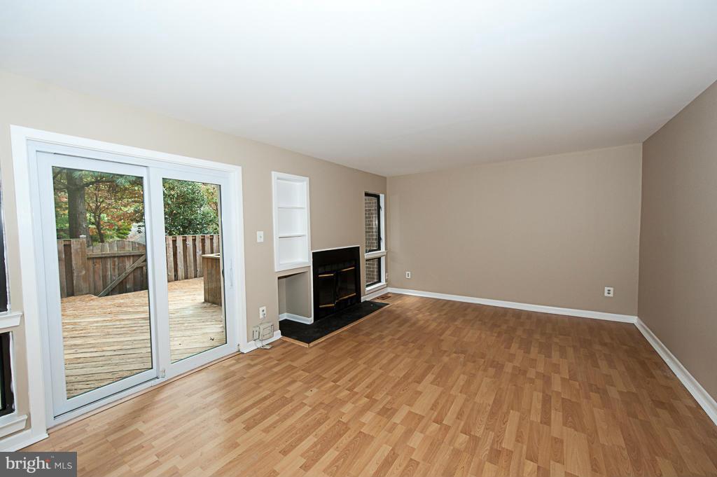 11011 Thrush Ridge Road Reston, VA 20191 - Photo 9 of 30 a view of empty room with wooden floor and fireplace