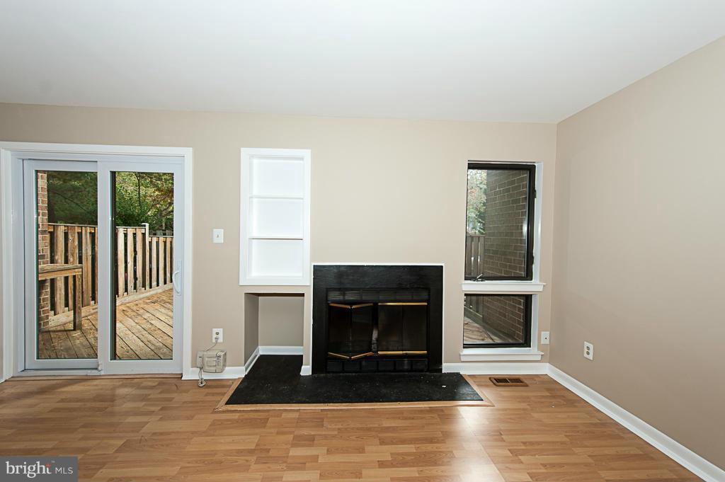 11011 Thrush Ridge Road Reston, VA 20191 - Photo 10 of 30 a living room with furniture and a fireplace