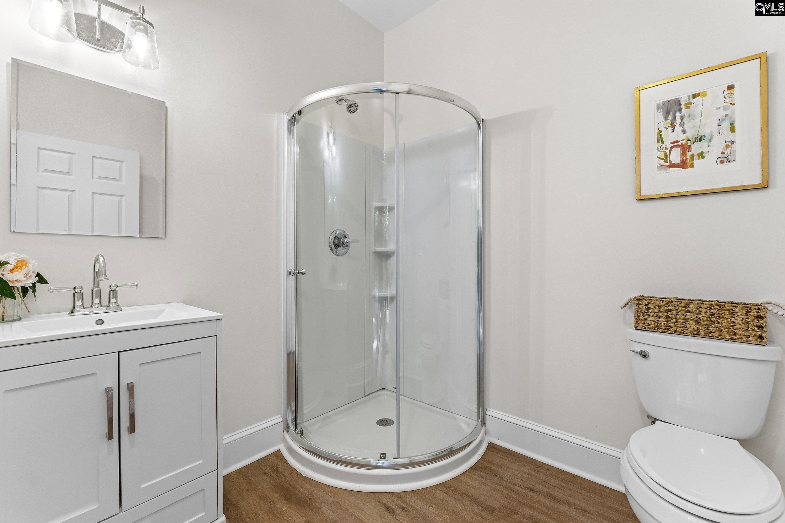 121 Silver Lake Road East Columbia, SC 29223 - Photo 23 of 57 a bathroom with a toilet a sink and mirror