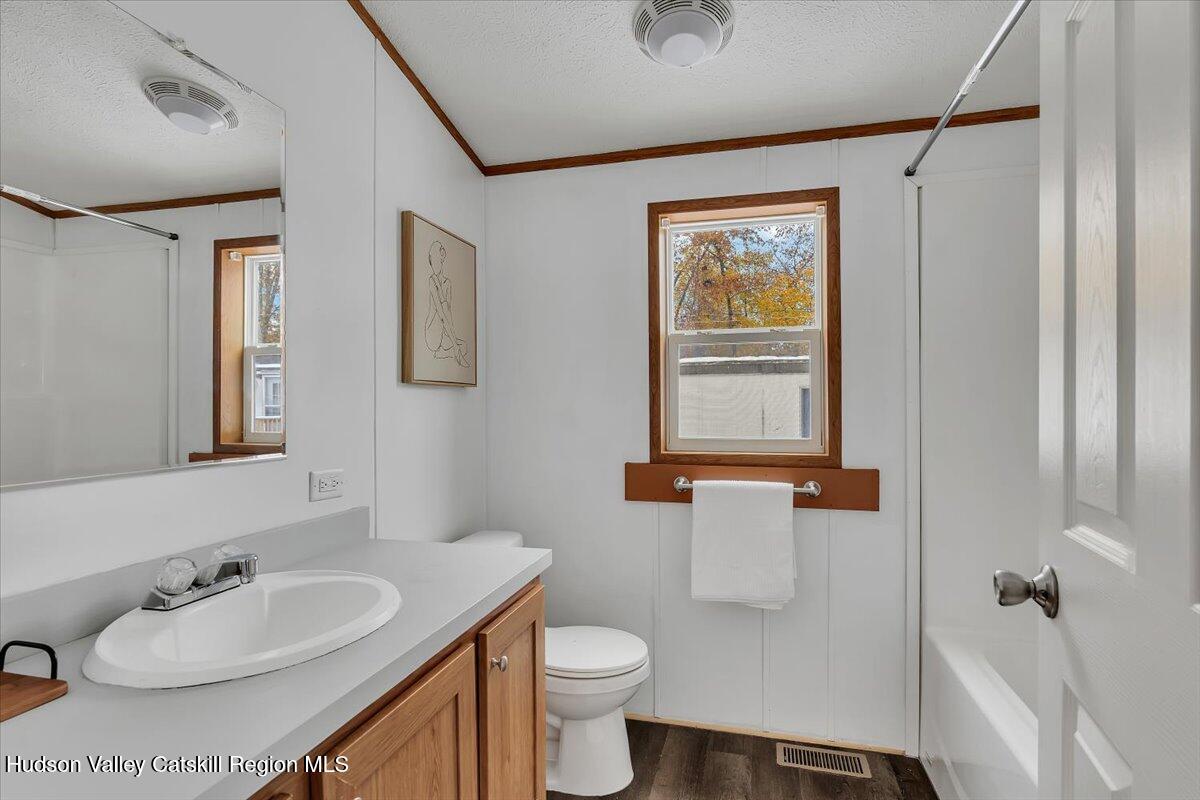 331 Rowland Street, Unit 51 Ballston Spa, NY 12020 - Photo 12 of 18 a bathroom with a sink toilet and shower