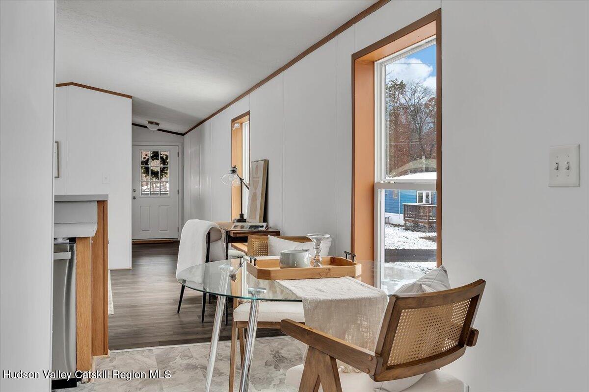 331 Rowland Street, Unit 51 Ballston Spa, NY 12020 - Photo 14 of 18 a view of a livingroom with furniture and window