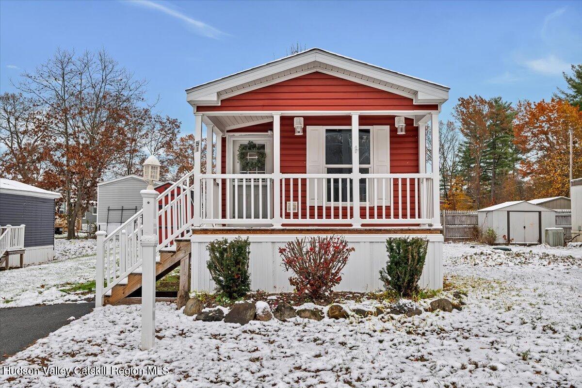 331 Rowland Street, Unit 51 Ballston Spa, NY 12020 - Photo 2 of 18 a front view of a house with a yard