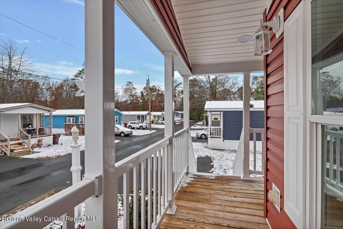 331 Rowland Street, Unit 51 Ballston Spa, NY 12020 - Photo 3 of 18 a view of a porch with wooden floor