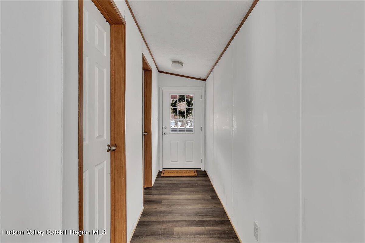 331 Rowland Street, Unit 51 Ballston Spa, NY 12020 - Photo 4 of 18 a view of a hallway with wooden floor and staircase