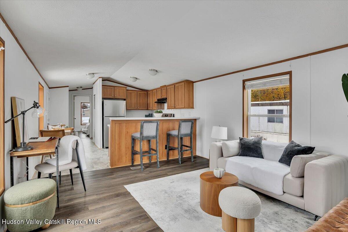 331 Rowland Street, Unit 51 Ballston Spa, NY 12020 - Photo 6 of 18 a living room with furniture and a wooden floor