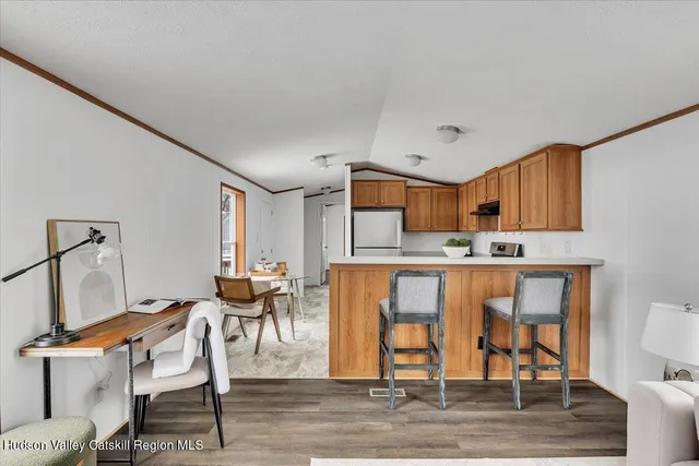 a living room with furniture a dining table and chairs