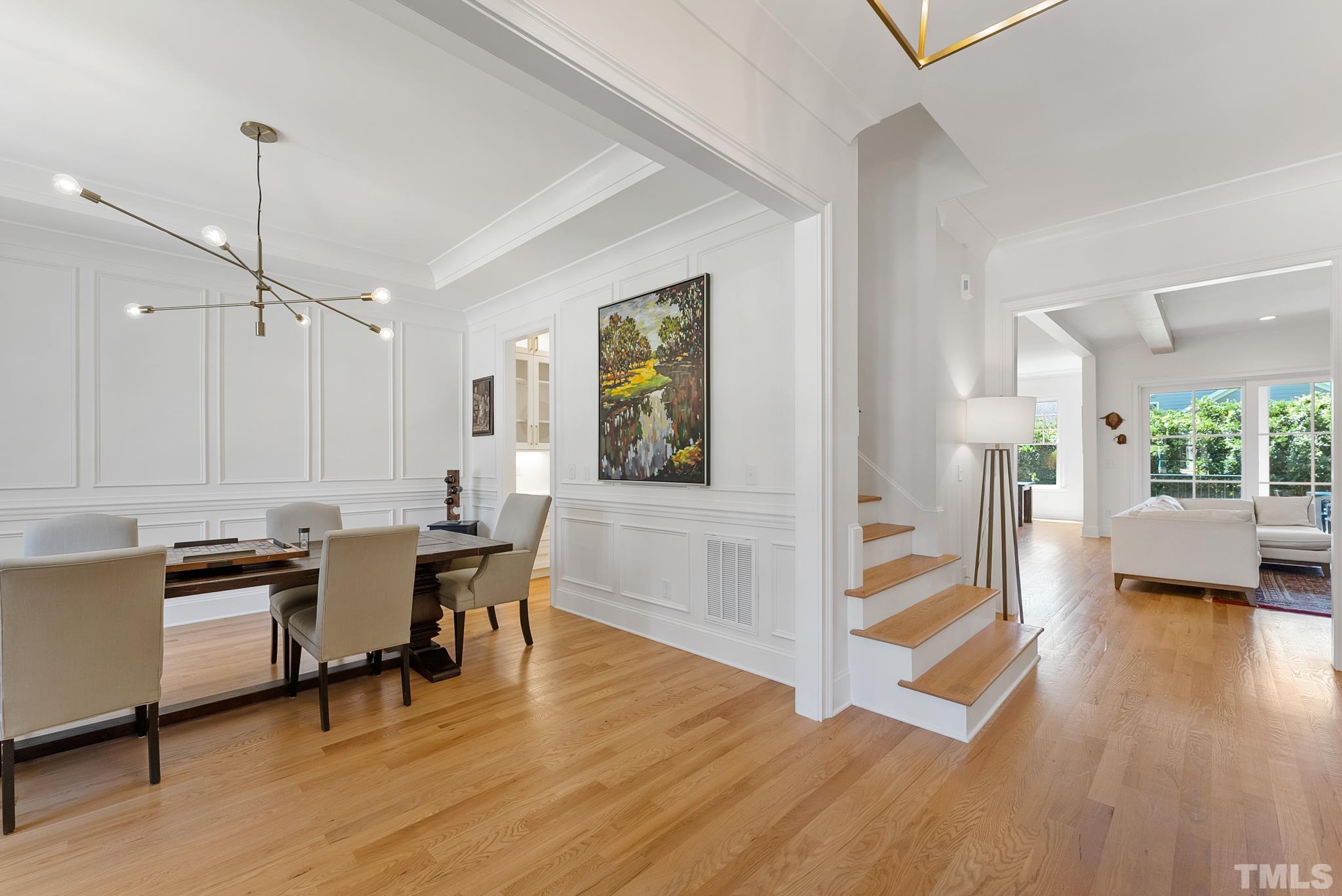 3401 Lewis Farm Road Raleigh, NC 27607 - Photo 4 of 75 a view of a dining room with furniture and wooden floor