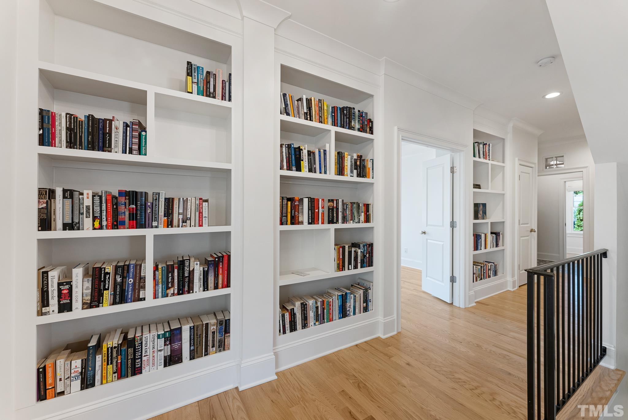 3401 Lewis Farm Road Raleigh, NC 27607 - Photo 54 of 75 a living room with lots of books